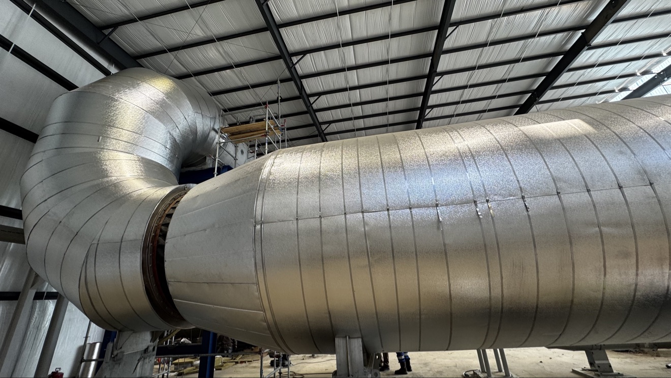 Finished metal jacketing protecting industrial insulation